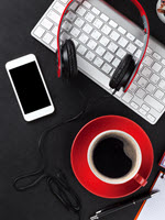 Headphones coffee keyboard and phone